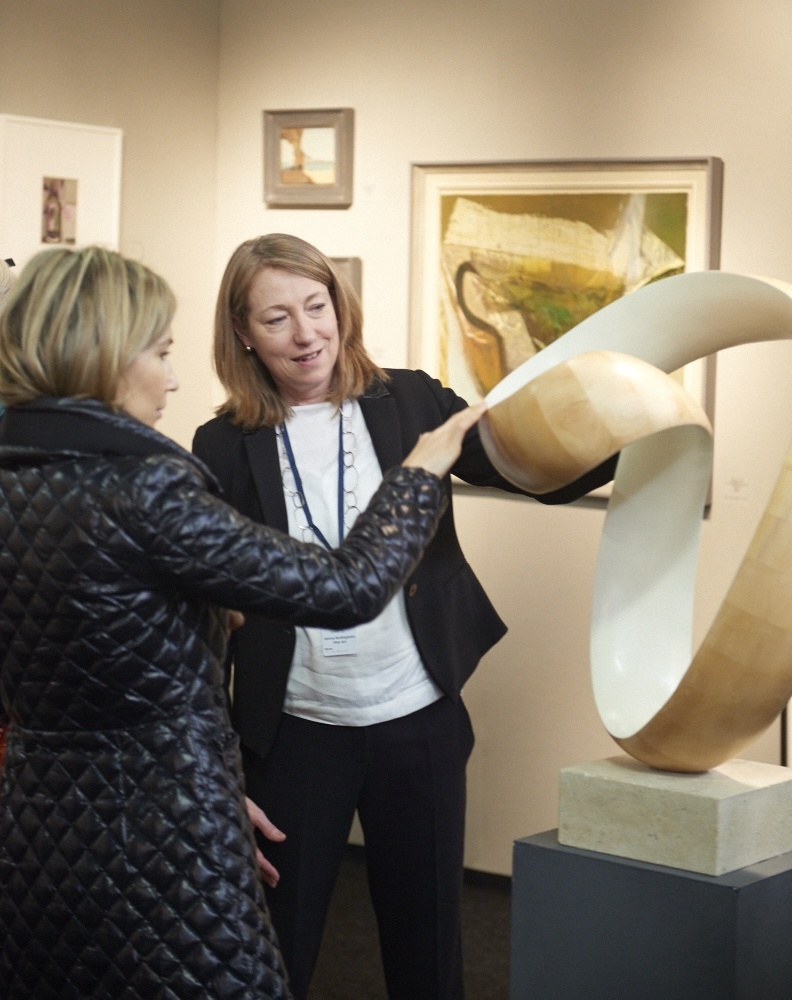 Jane Skingley discussing one of Richard Fox's sculptures with a client at The Decorative Fair, Autumn 2015