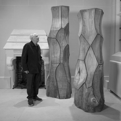 Photograph of David Nash with his sculptures, date unknown