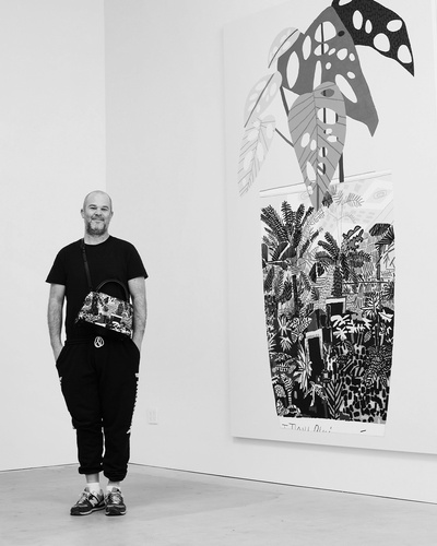 Photograph of Jonas Wood inside his East Hollywood studio. Wood is featured here wearing the new limited-edition Capucines bag, a collaboration with LOUIS VUITTON, inspired by his painting Landscape Pot 2, 2014. (Photograph by Peter Wetherell).